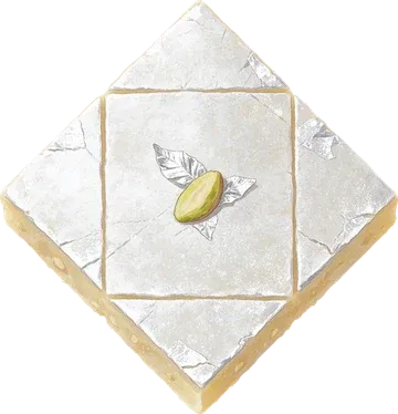 A diamond of kaju katli with silver leaf