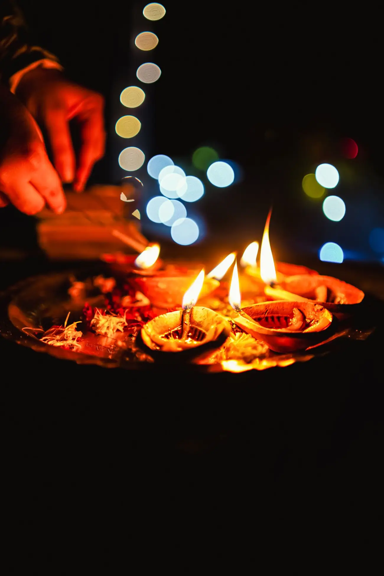 Rows of small flames and lanterns lit for the toast