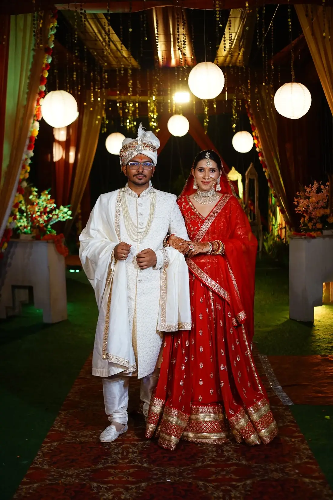 A couple in traditional attire at their wedding